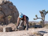 A Climb Smart attendee moves rocks as part of the Climb Smart service project on Saturday, October 19, 2019 in Joshua Tree National Park, Calif.  The Climb Smart stewardship project, in partnership with the National Park, focuses on lining specific desired paths with rocks to discourage the creation of new use-paths in the heavily impacted area.  (Photo by Suzanne Steiner)