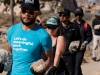 Dang Le at the front of a group of climbers at the Climb Smart service project on Saturday, October 19, 2019 in Joshua Tree National Park, Calif.  The Climb Smart stewardship project, in partnership with the National Park, focuses on lining specific desired paths with rocks to discourage the creation of new use-paths in the heavily impacted area.  (Photo by Suzanne Steiner)