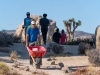 Climbers transport  rocks as part of the Climb Smart service project on Saturday, October 19, 2019 in Joshua Tree National Park, Calif.  The Climb Smart stewardship project, in partnership with the National Park, focuses on lining specific desired paths with rocks to discourage the creation of new use-paths in the heavily impacted area.  (Photo by Suzanne Steiner)